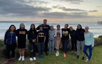 2022 SeaTech cohort stands in front of ocean